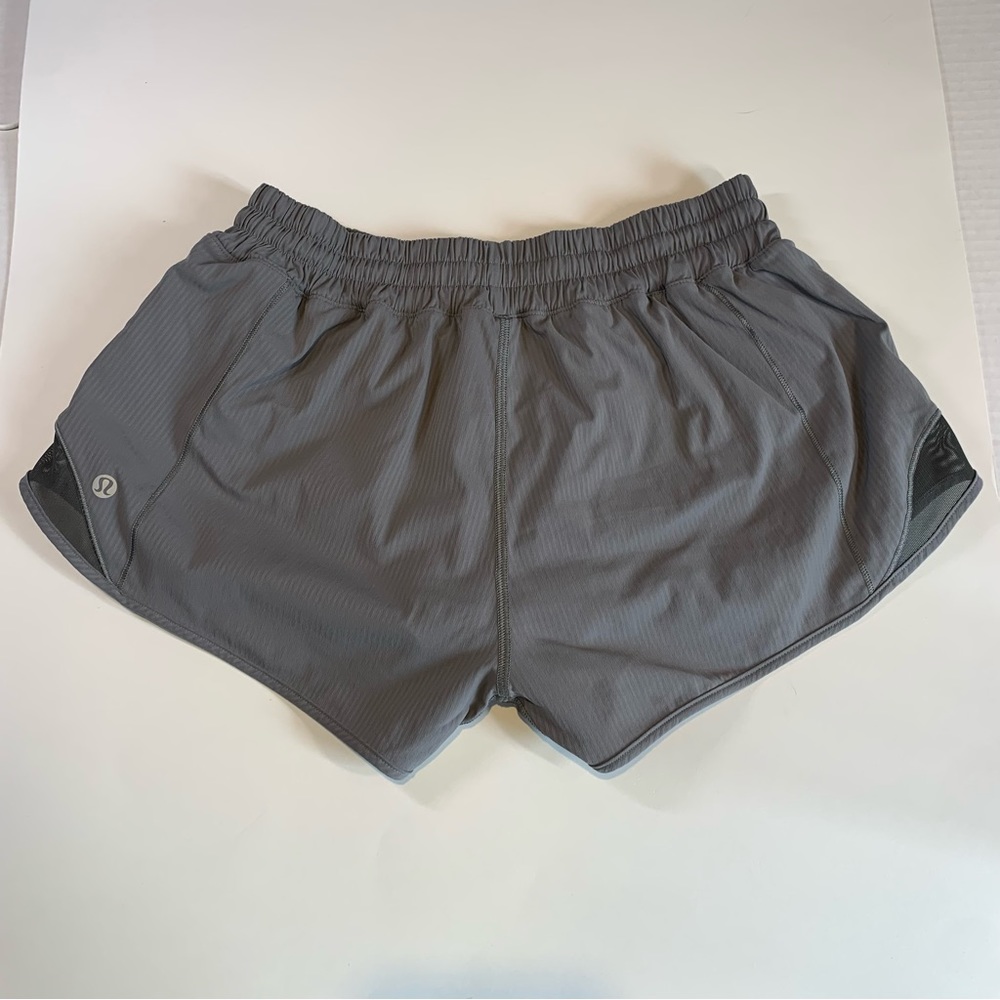 Size 6 Lululemon grey shorts with black liner, elastic waist & mesh detailing